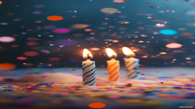Birthday wishes shine through on a sleek Android wallpaper with candles and confetti in focus.