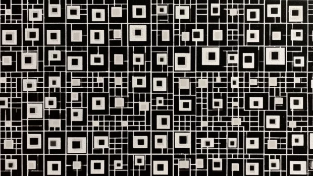 Black and white geometric mosaic wallpaper combining tiny squares and rectangles in rhythmic grid composition.