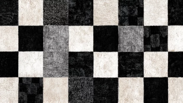 Black and white geometric pattern wallpaper showing bold checkerboard squares with delicate textured overlay.