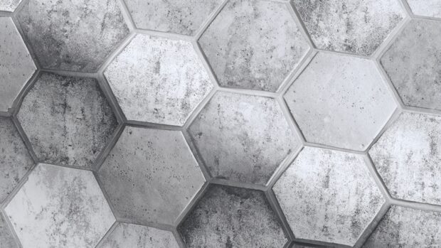 Black and white geometric wallpaper featuring interlocking hexagon shapes with subtle texture overlay.