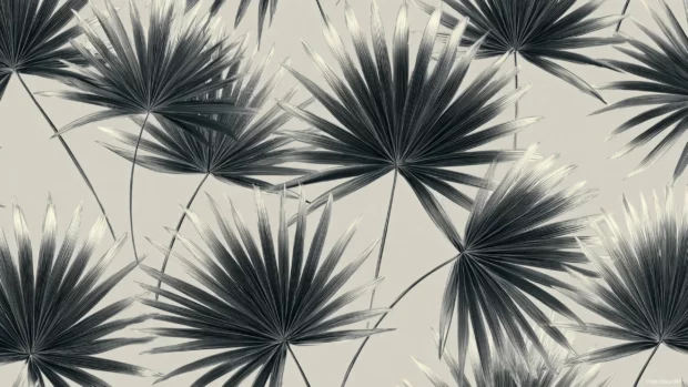 Black and white palm leaves wallpaper pattern showing repeating palm frond silhouettes on soft grey canvas.