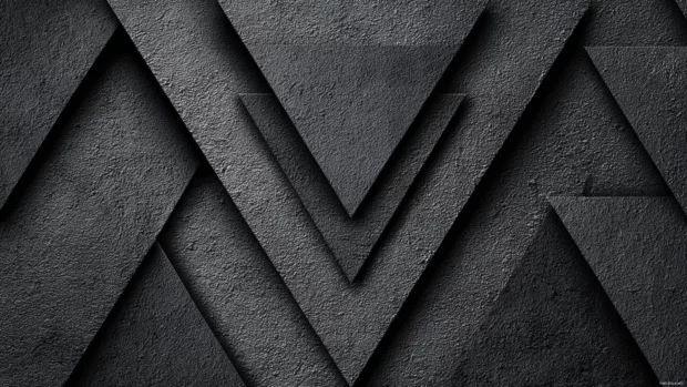 Black geometric pattern wallpaper with bold triangles layered over textured charcoal background.