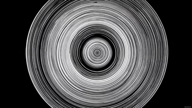 Circular motion in Black and White Geometric design resembling vinyl record grooves.