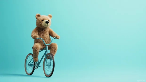 Cool bear riding a bicycle with a clean and empty background.