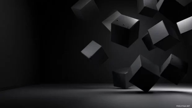 Dark geometric desktop wallpaper with floating 3d cubes casting soft shadows over matte black surface.