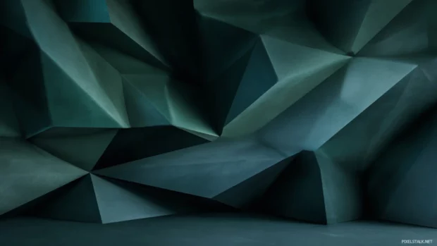 Dark green geometric wallpaper capturing bold triangular peaks and deep emerald shadows for dramatic mood.