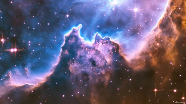 Deep space nebula with vivid purple and blue hues 2560x1440 wallpaper showcasing cosmic beauty.