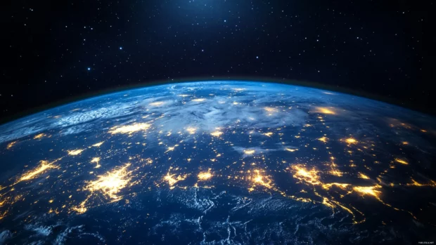 Earth from space glowing with city lights, detailed view of continents and oceans.