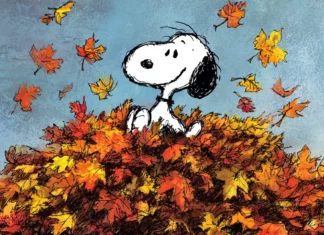 Fall afternoon with Snoopy joyfully playing in a pile of colorful autumn leaves.