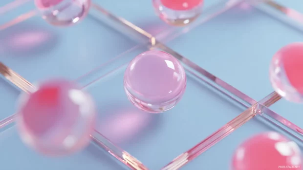 Geometric layout with floating pink orbs and transparent edges in soft focus.