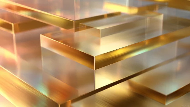 Gold geometric layers with a glassy effect and soft blurred background shadows.