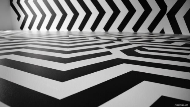 High contrast Geometric wallpaper with black and white zigzags forming hypnotic shapes.