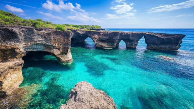 Japan coastal cliffs with turquoise waters and dramatic rock formations.