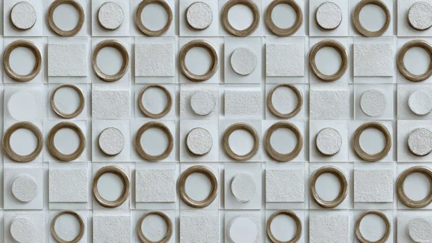 Modern geometric tile wallpaper featuring repeating square and circle mosaic with subtle shadow depth.