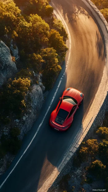 Porsche 911 gt3 rs seen from above slicing through a winding mountain road at sunrise (2) (1).