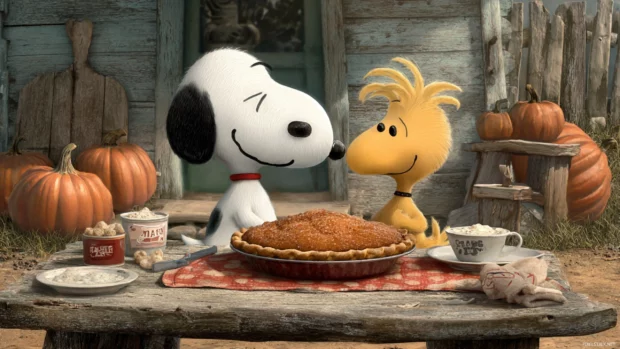 Snoopy thanksgiving desktop wallpaper illustrating Snoopy and Woodstock sharing a pumpkin pie at rustic table outdoors.