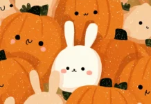 A charming design of round cute pumpkins with bunny ears and sweet faces in a repeating pattern.