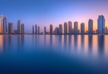 A clean and simple depiction of the Dubai Marina with its iconic skyscrapers and calm waters.