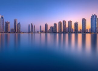 A clean and simple depiction of the Dubai Marina with its iconic skyscrapers and calm waters.
