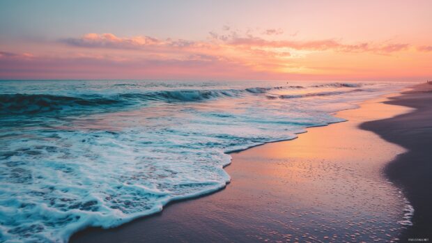 Beach images wallpaper, A serene sunset over a tranquil beach with gentle waves lapping the shore, soft pastel colors reflecting on the water.