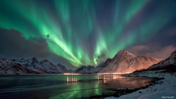 Best high resolution wallpaper hd presenting a breathtaking view of the Northern Lights over a snowy arctic landscape.