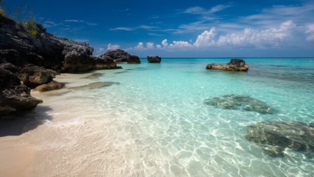 Best laptop wallpapers depicting a serene beach with crystal clear waters.