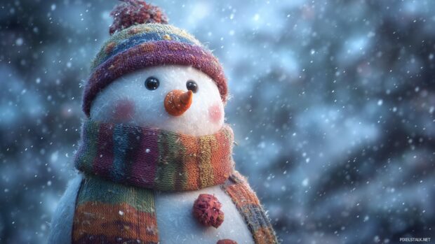 Charming snowman wallpapers HD adorned with a colorful scarf and a carrot nose, set against a winter wonderland.
