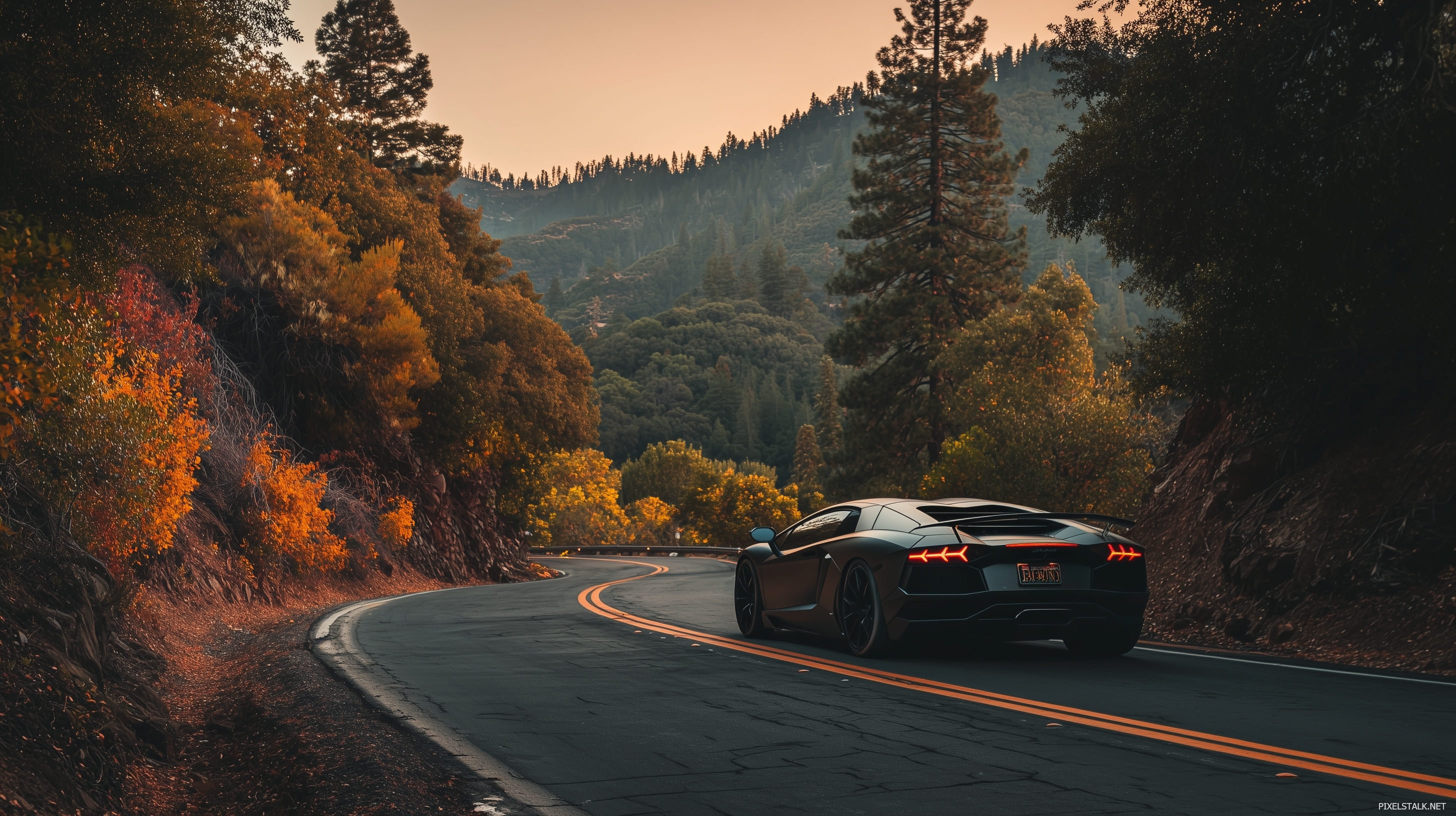 Cool laptop wallpapers displaying a sleek sports car on a windin.