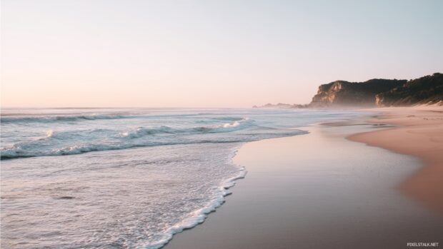 Deserted beach with gentle waves under a pastel sky, beautiful beach hd wallpapers.