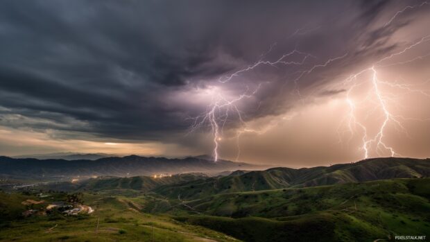 Desktop Lightning HD Wallpapers, A collection of breathtaking high definition wallpapers showcasing dramatic lightning strikes over rolling hills.