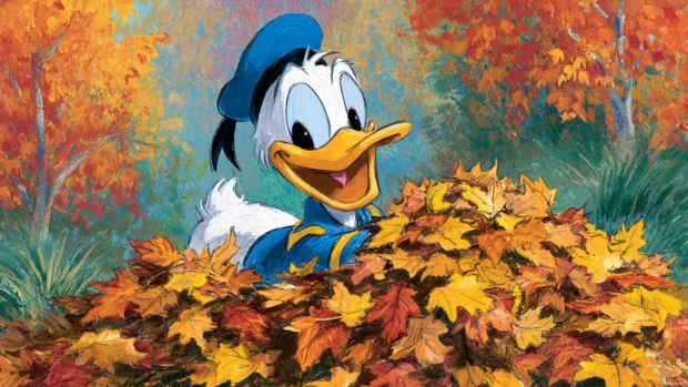 Donald Duck playing in piles of autumn leaves with bright seasonal colors filling the background.