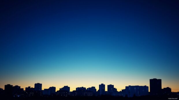 Free background wallpaper with a minimalist urban skyline at dusk.