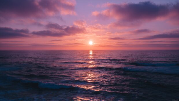 High resolution desktop sky backgrounds capturing a serene sunset over a calm ocean.