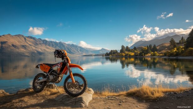 High resolution dirt bike wallpapers free illustrating a picturesque landscape with a bike parked near a lake.