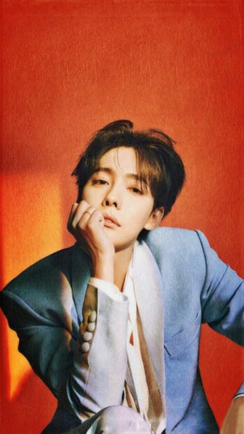 Jinu Elegant Portrait in Stylish Suit for Wallpaper Decor.