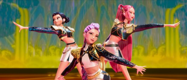 KPop Demon Hunters perform dynamic dance routine on vibrant stage.