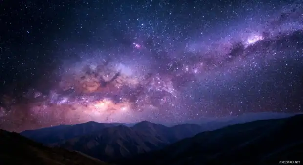 Live wallpapers 4k desktop showing swirling cosmic nebula over dark mountain ridge.