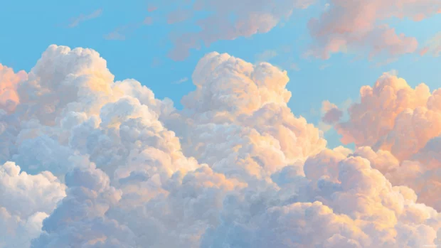 Soft cloud desktop background blending fluffy clouds with pale blue sky and golden hour light, airy and calm.