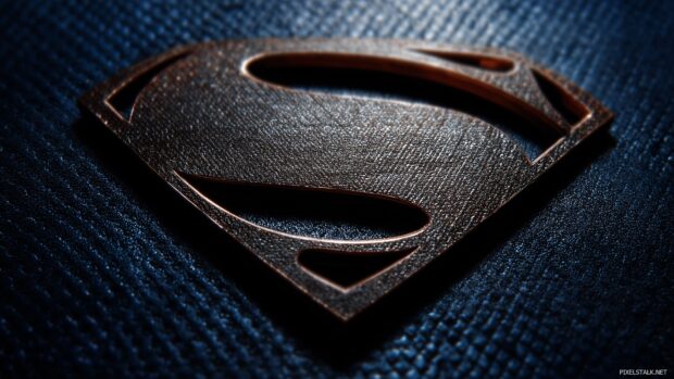 Superman backgrounds for desktop, A detailed close up of Superman emblem against a textured metallic background, emphasizing strength.