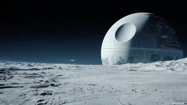 The Death Star looming over a barren moon surface as star wars.