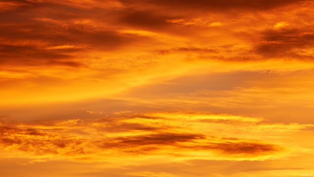 Vibrant desktop sky backgrounds with striking shades of orange and yellow at sunset.