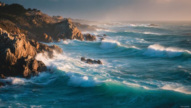 1440p ocean images, Turquoise waves crashing against rugged cliffs during golden hour.
