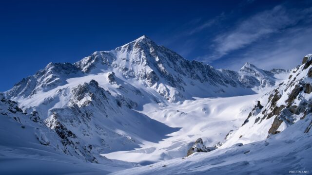 1920x1080 HD wallpaper natural beauty, a majestic snowy mountain range with a clear blue sky above.