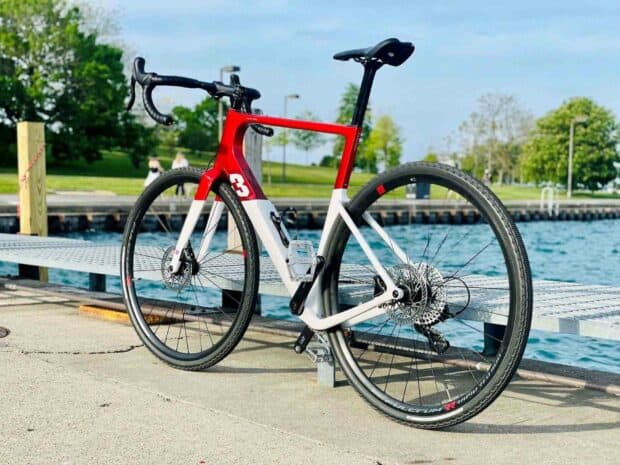 This 3T bike features a red and white frame parked by the waterfront on a sunny day, HD Desktop Wallpaper