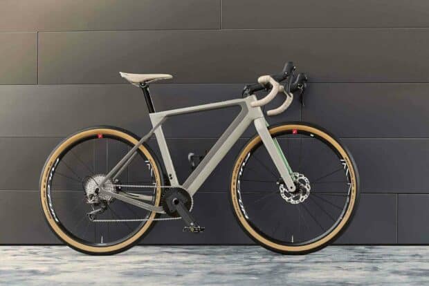 A sleek 3T bike with beige and black colors is standing against a dark tiled wall, HD Desktop Wallpaper