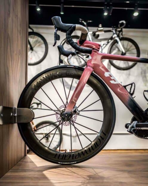 A close up of a 3T bike showing its sleek frame and detailed wheel design, 2K Desktop Wallpaper