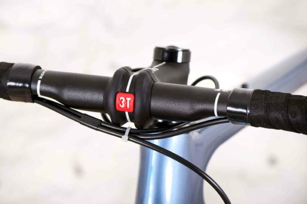 A close up of a 3T bike handlebar with black grips and cables, 2K Desktop Wallpaper