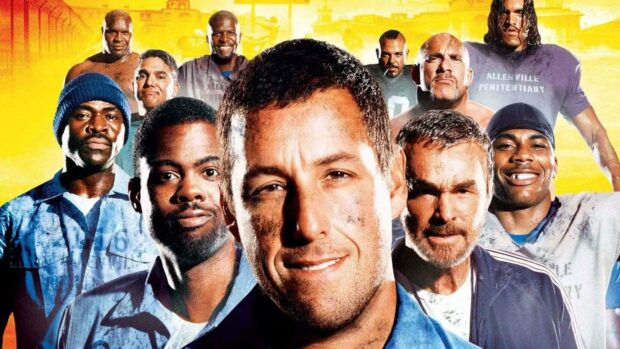 Adam Sandler stands with a diverse group of men in prison uniforms in front of a vivid yellow background, HD Desktop Wallpaper