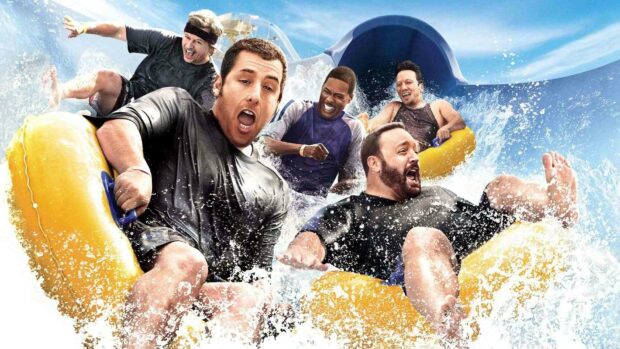 Adam Sandler and his friends are riding yellow rafts down a water slide with splashing water around them, HD Desktop Wallpaper