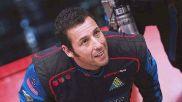 Adam Sandler wearing a racing suit with a focused expression, HD Desktop Wallpaper